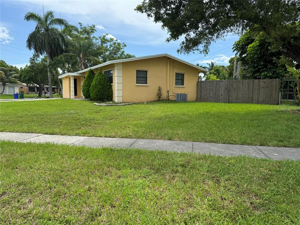 6101 Northwest 18th Street Margate, FL 33063 - Photo 4 of 22 a view of a house with a yard
