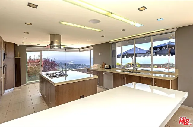 a room with a large window and a table