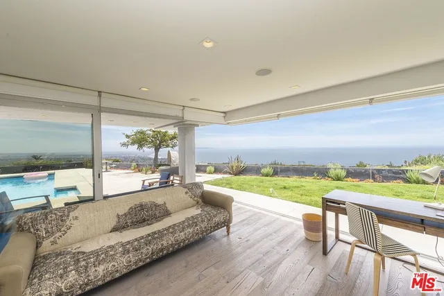 a bathroom with a bathtub shower sink and mirror