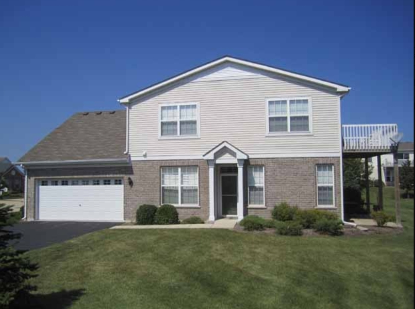1547 Millbrook Drive Algonquin, IL 60102 - Photo 1 of 17 a front view of a house with a yard