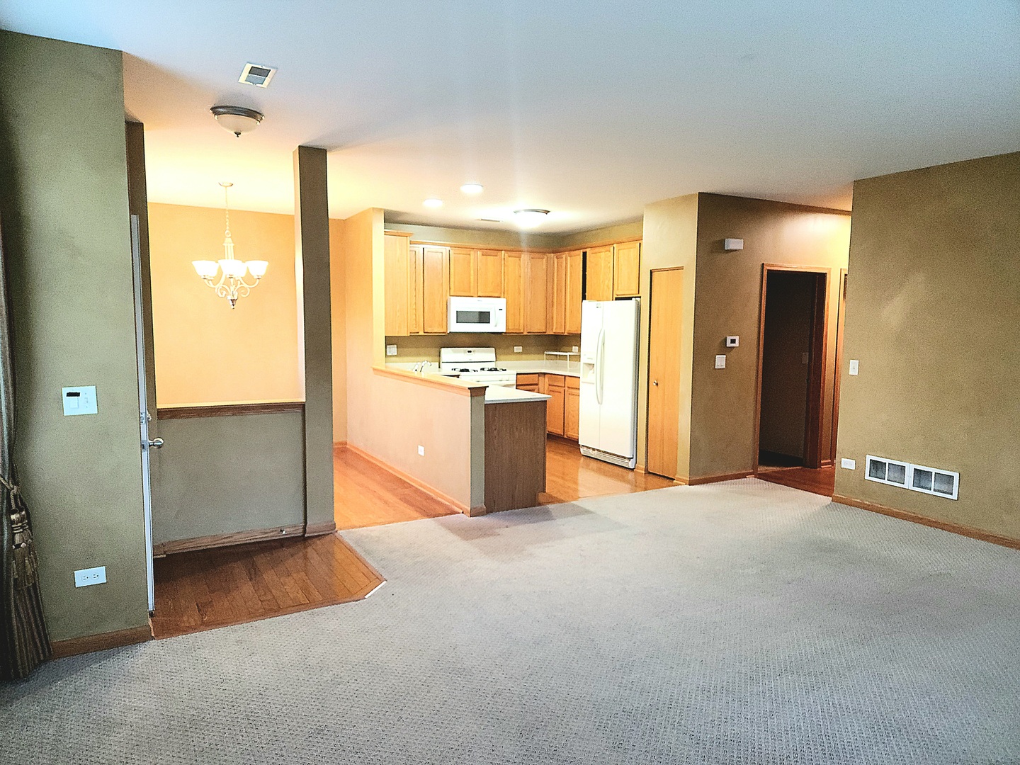 1547 Millbrook Drive Algonquin, IL 60102 - Photo 4 of 17 a view of a kitchen with a sink and a refrigerator