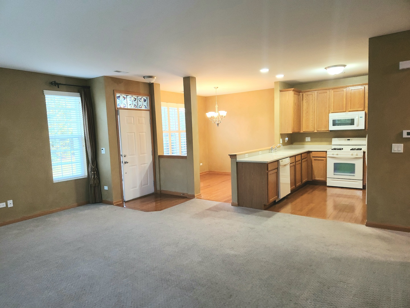 1547 Millbrook Drive Algonquin, IL 60102 - Photo 5 of 17 a view of a kitchen with a sink cabinets and a window