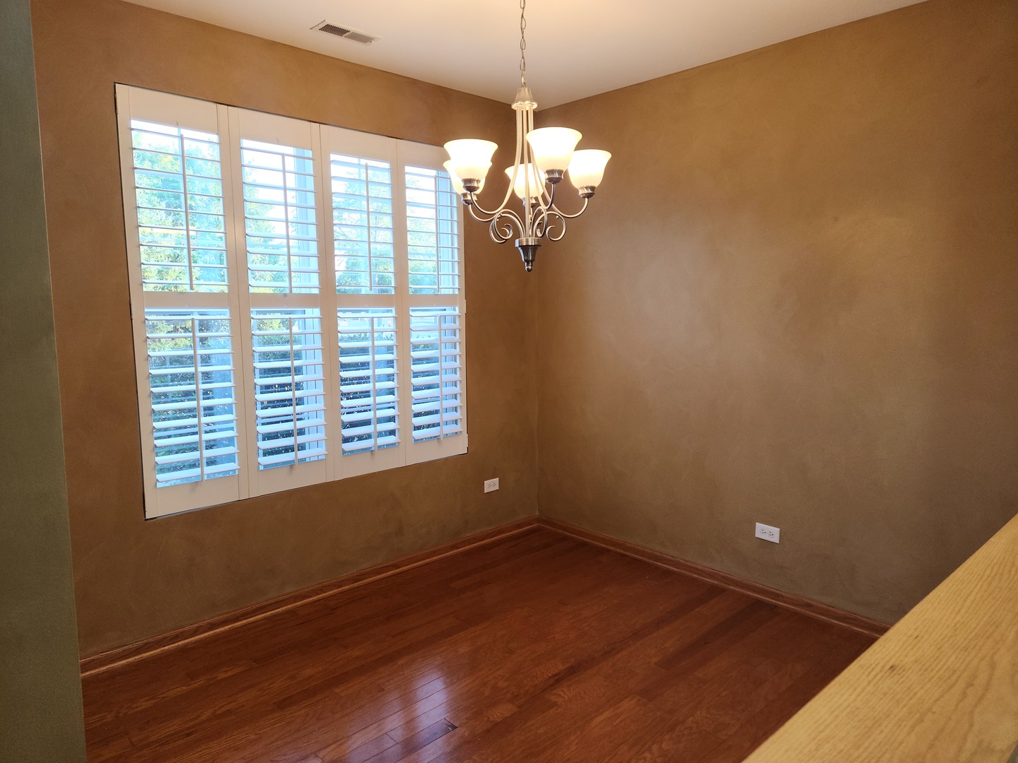 1547 Millbrook Drive Algonquin, IL 60102 - Photo 9 of 17 a view of a room with wooden floor and a window