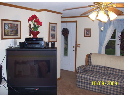 68 Fair Oak Road Springfield, MA 01128 - Photo 13 of 26 a living room with furniture and a fireplace