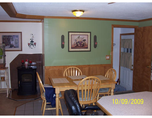 68 Fair Oak Road Springfield, MA 01128 - Photo 17 of 26 a view of a room that has a couch and a dining table with wooden floor
