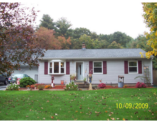 68 Fair Oak Road Springfield, MA 01128 - Photo 3 of 26 a front view of house with yard and outdoor seating