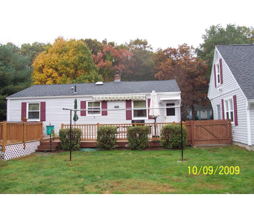 68 Fair Oak Road Springfield, MA 01128 - Photo 4 of 26 a front view of house with yard and trees in the background