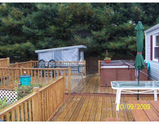 68 Fair Oak Road Springfield, MA 01128 - Photo 6 of 26 a balcony with an outdoor seating