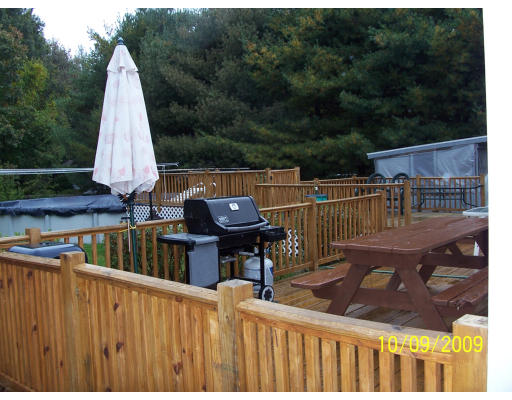68 Fair Oak Road Springfield, MA 01128 - Photo 7 of 26 a view of deck with two chair and wooden fence