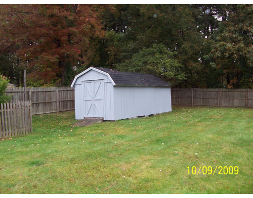 68 Fair Oak Road Springfield, MA 01128 - Photo 10 of 26 a backyard of a house with a garden and deck