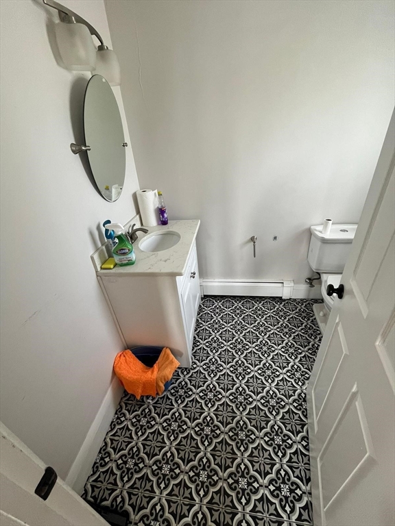 72 Bristow Street Saugus, MA 01906 - Photo 6 of 7 a bathroom with a sink toilet and a mirror