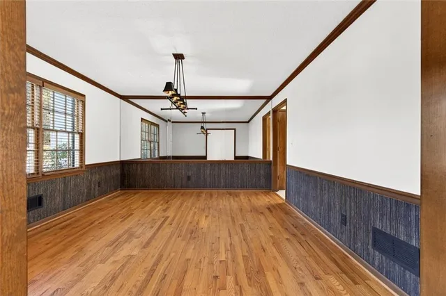 a kitchen with stainless steel appliances granite countertop a refrigerator and a stove