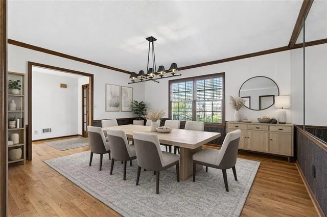 a kitchen with granite countertop a refrigerator and a stove top oven