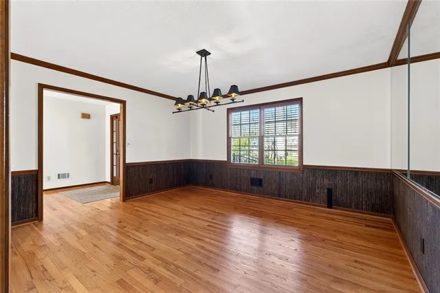 a kitchen with stainless steel appliances granite countertop a sink and cabinets