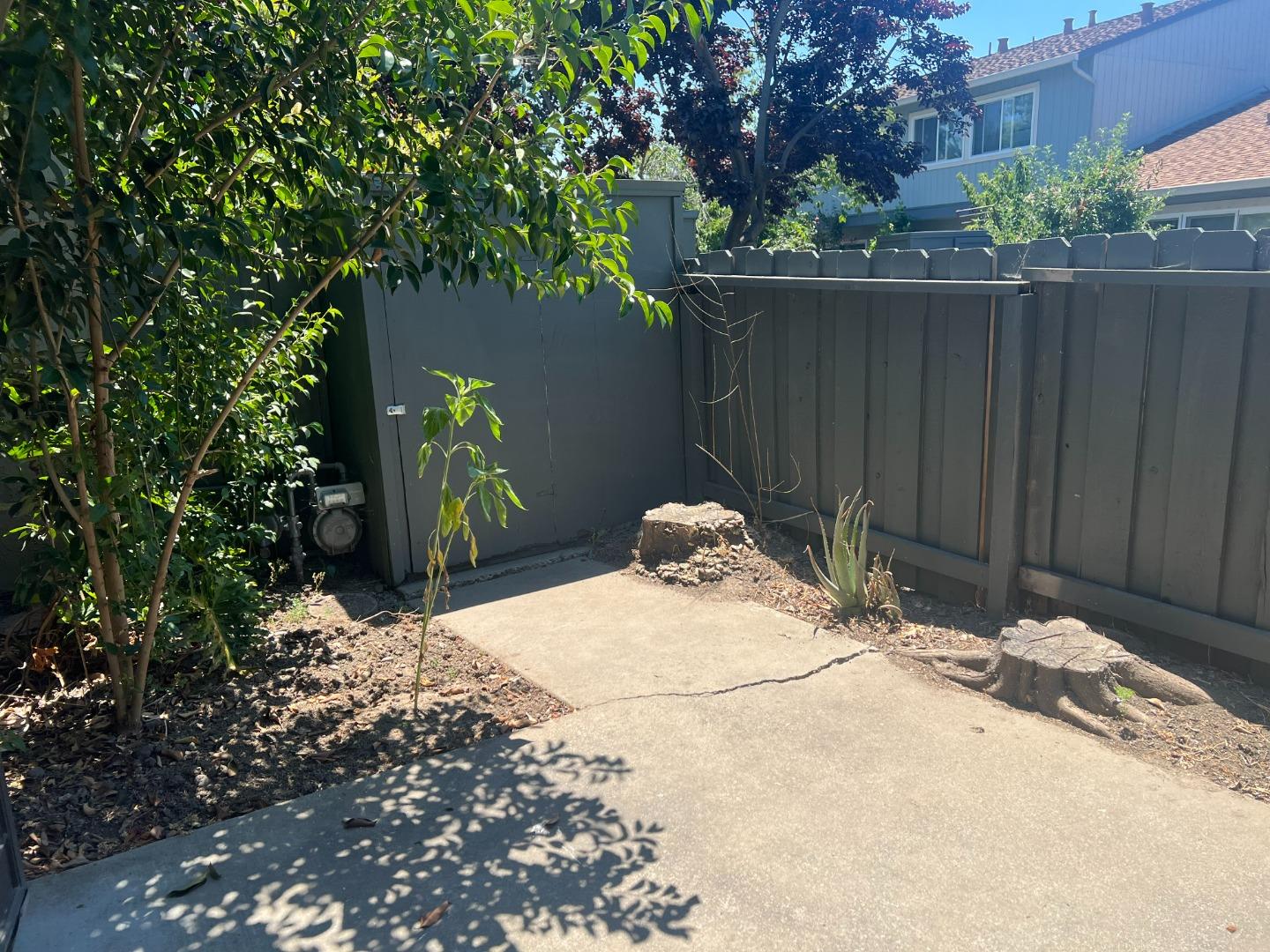 4685 Persimmon Place San Jose, CA 95129 - Photo 13 of 13 a backyard of a house with table and chairs