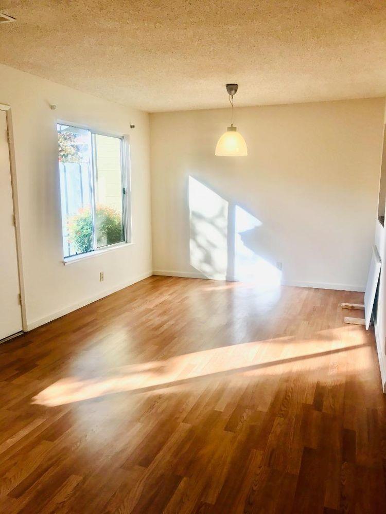 4685 Persimmon Place San Jose, CA 95129 - Photo 6 of 13 a view of empty room with window and wooden floor