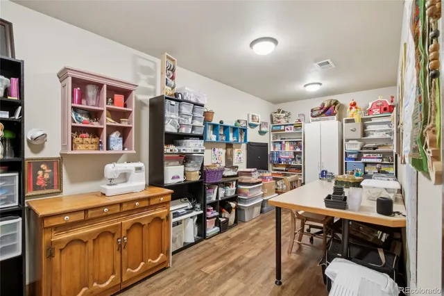 a living room with lots of furniture and white walls