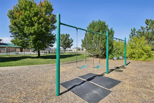 a view of a park with large trees