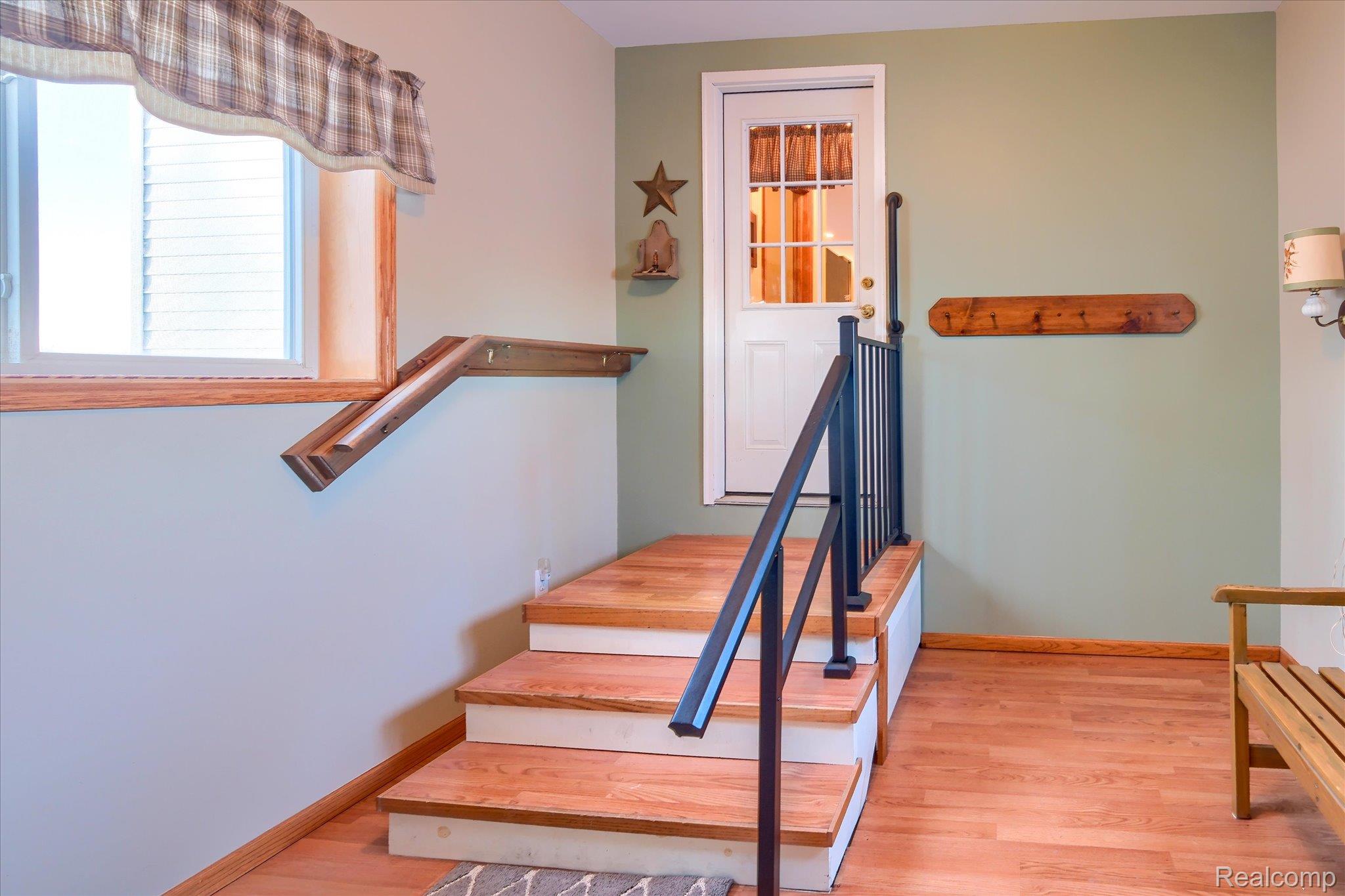 6941 North Lake Pleasant Road North Branch, MI 48461 - Photo 31 of 51 Stairs with wood finished floors and baseboards
