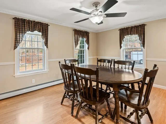 a view of a dining room with furniture window and outside view