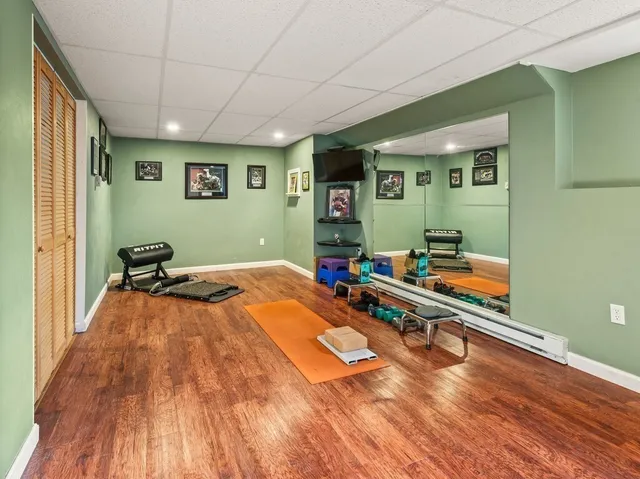 a room with gym equipment and a large window