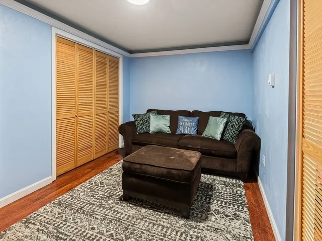 a living room with furniture and a rug