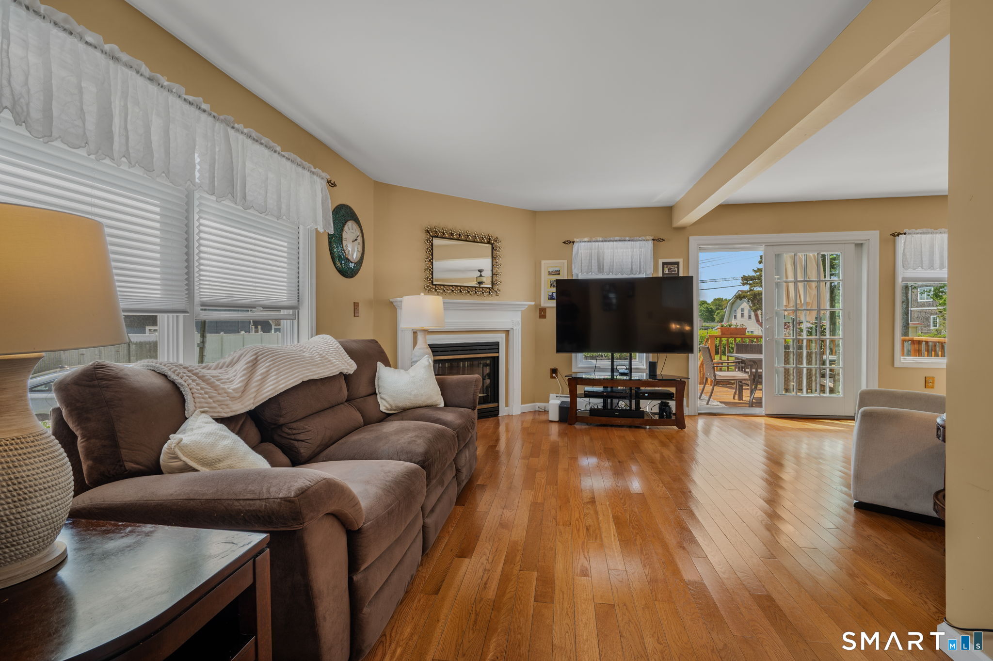 212 R Shore Road Waterford, CT 06385 - Photo 17 of 28 a living room with fireplace furniture and a flat screen tv