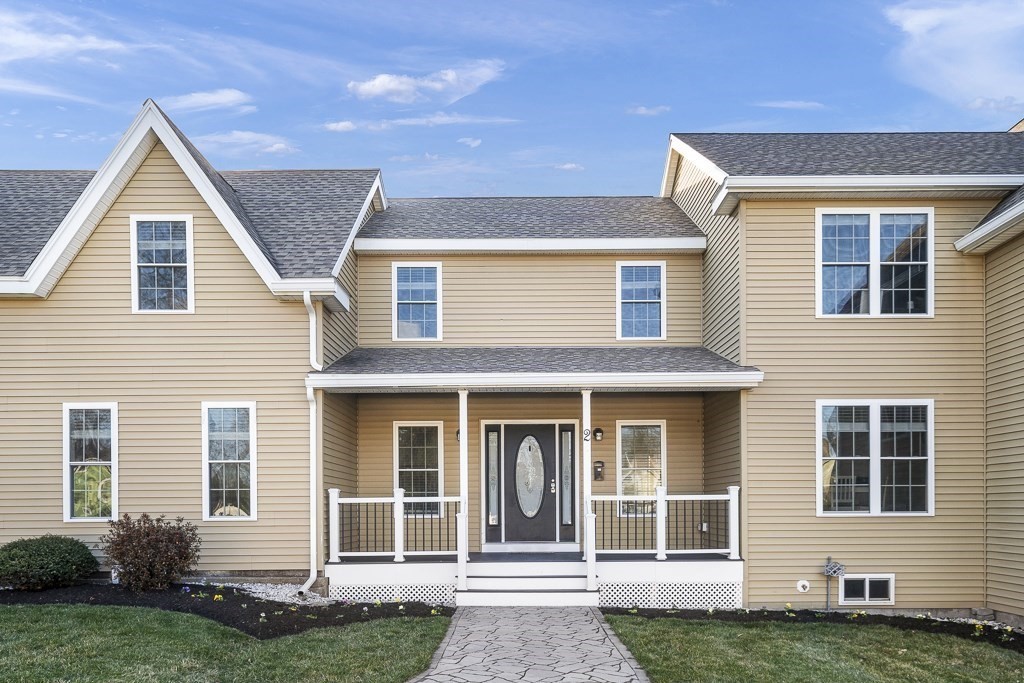 2 Willow Avenue Danvers, MA 01923 - Photo 1 of 42 a front view of a house with a yard
