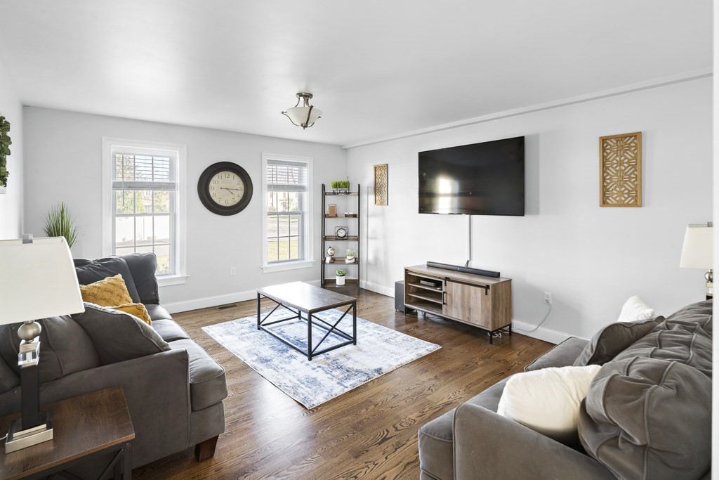 2 Willow Avenue Danvers, MA 01923 - Photo 11 of 42 a living room with furniture and a flat screen tv