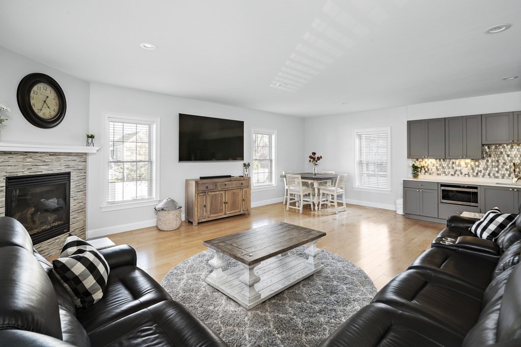 2 Willow Avenue Danvers, MA 01923 - Photo 17 of 42 a living room with furniture fireplace and flat screen tv