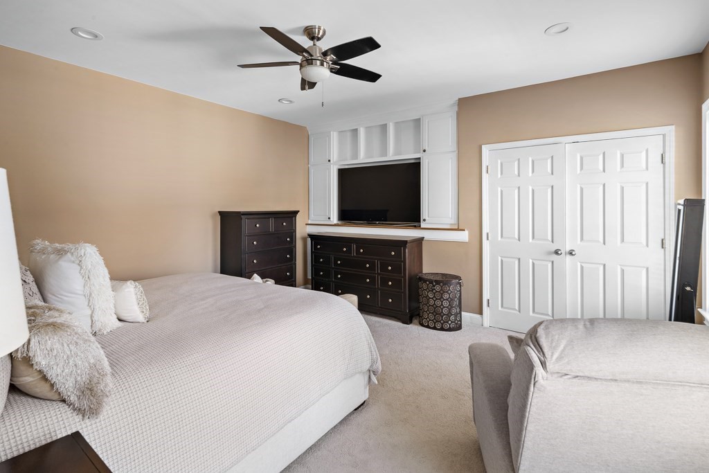 2 Willow Avenue Danvers, MA 01923 - Photo 20 of 42 a spacious bedroom with a bed and a flat screen tv