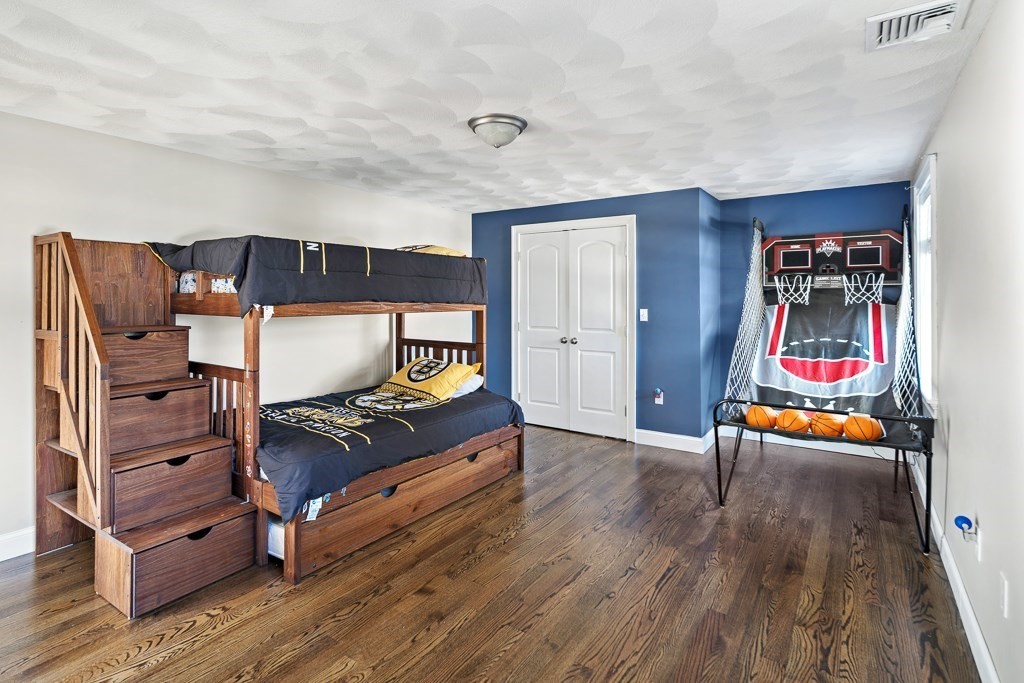 2 Willow Avenue Danvers, MA 01923 - Photo 22 of 42 a living room with furniture and a flat screen tv