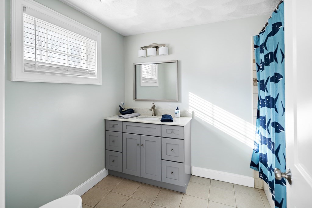 2 Willow Avenue Danvers, MA 01923 - Photo 29 of 42 a bathroom with a sink and a mirror