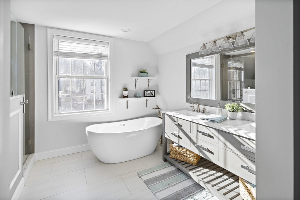 2 Willow Avenue Danvers, MA 01923 - Photo 32 of 42 a spacious bathroom with a double vanity sink a mirror and a bathtub
