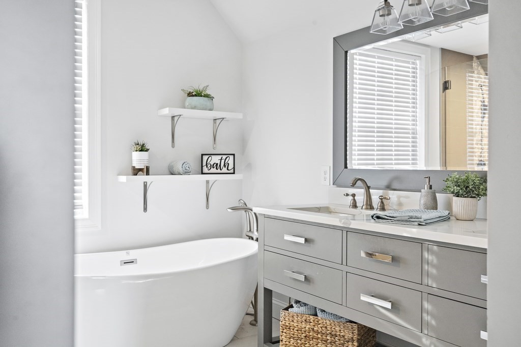 2 Willow Avenue Danvers, MA 01923 - Photo 33 of 42 a bathroom with a sink a toilet and mirror