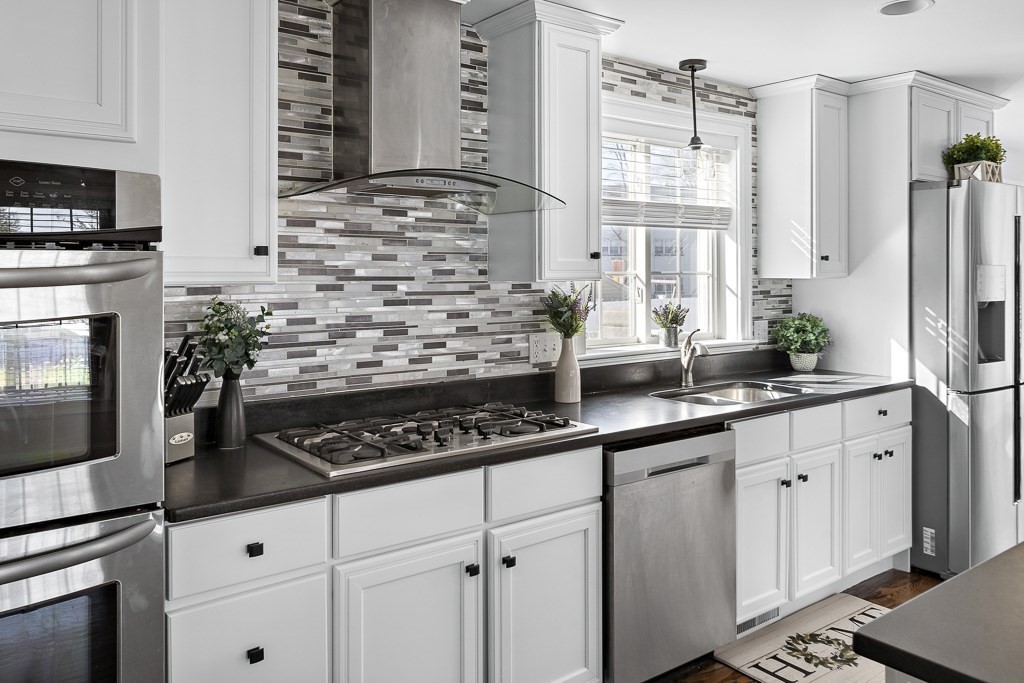 2 Willow Avenue Danvers, MA 01923 - Photo 6 of 42 a kitchen with appliances a sink and cabinets