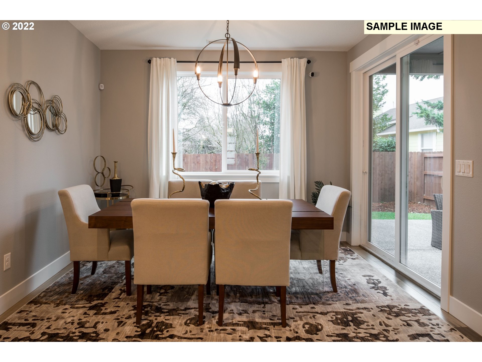 1644 South 51st Place Ridgefield, WA 98642 - Photo 5 of 20 a dining room with furniture a chandelier and wooden floor
