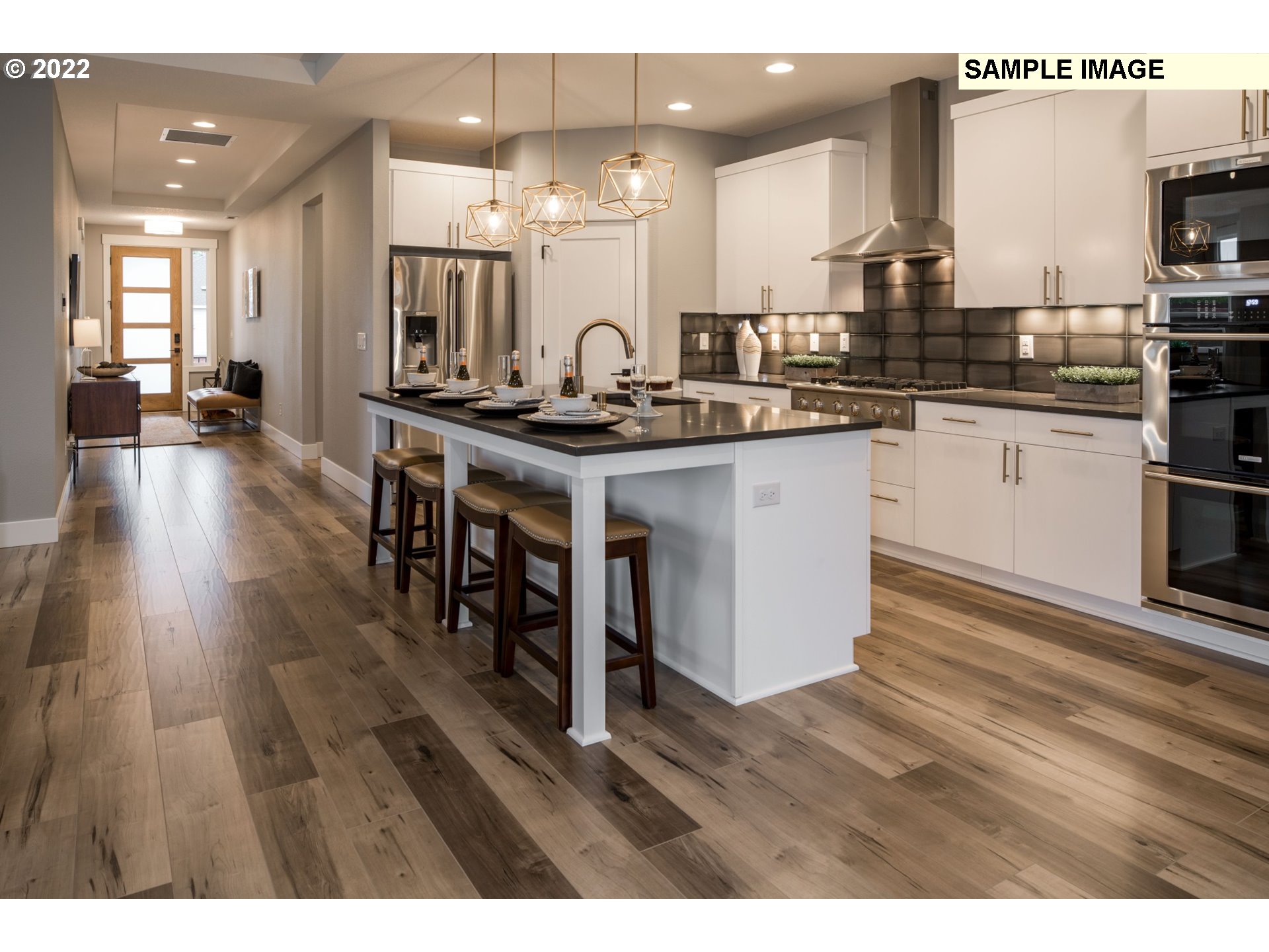 1644 South 51st Place Ridgefield, WA 98642 - Photo 7 of 20 a kitchen with a sink cabinets and wooden floor