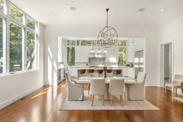 a kitchen with a counter top space appliances and a large window