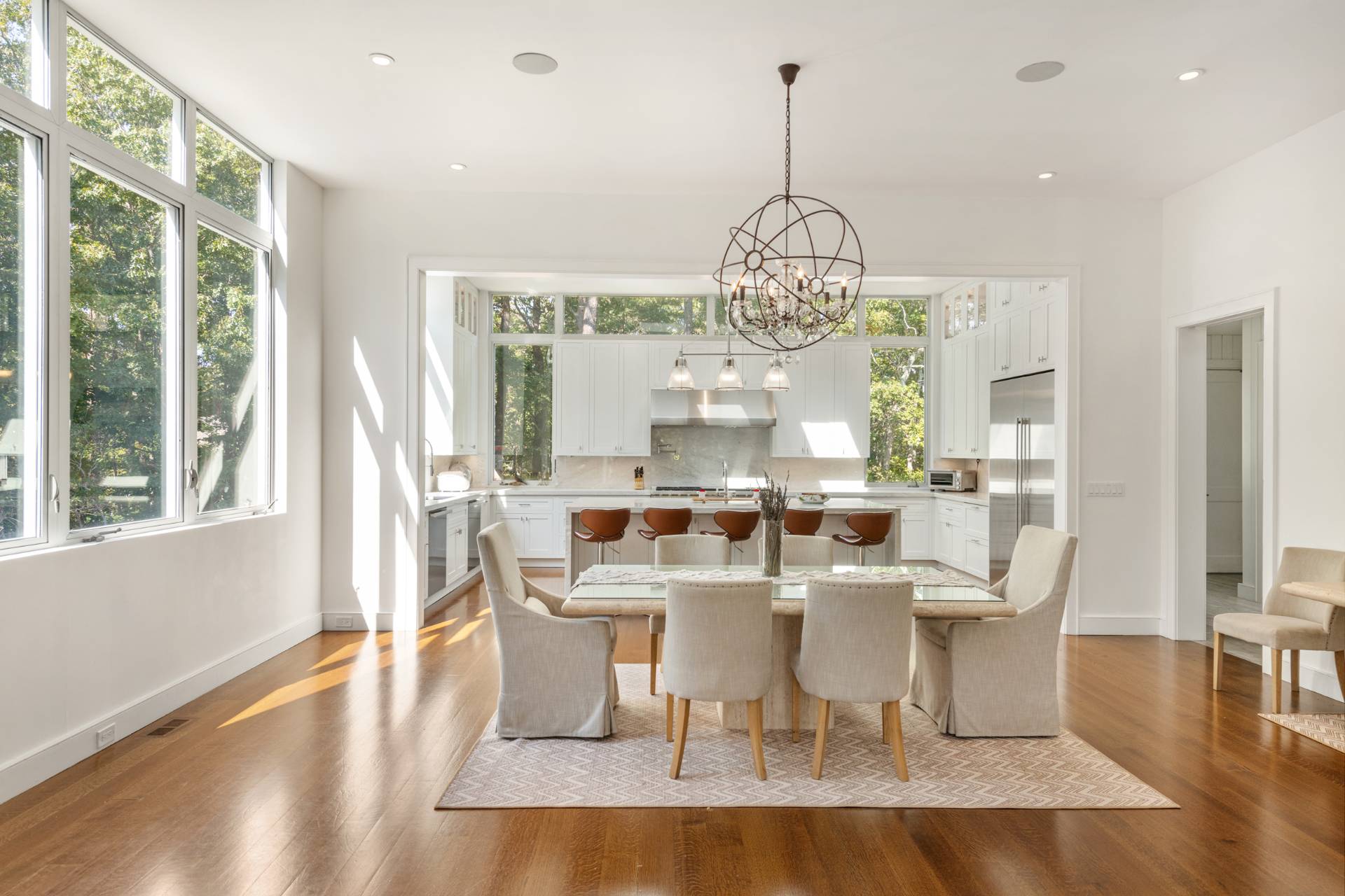 Undisclosed Address Sag Harbor, NY 11963 - Photo 11 of 36 a view of a dining room with furniture wooden floor and chandelier