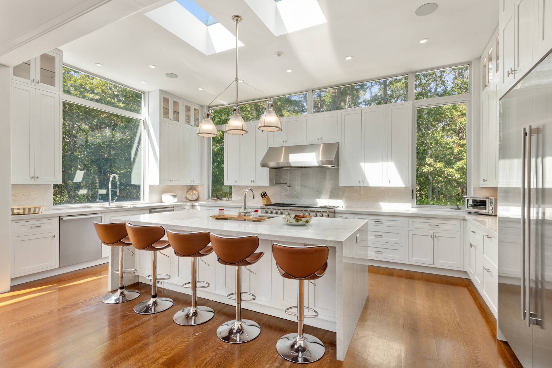 Undisclosed Address Sag Harbor, NY 11963 - Photo 12 of 36 a kitchen with a counter top space appliances and a large window