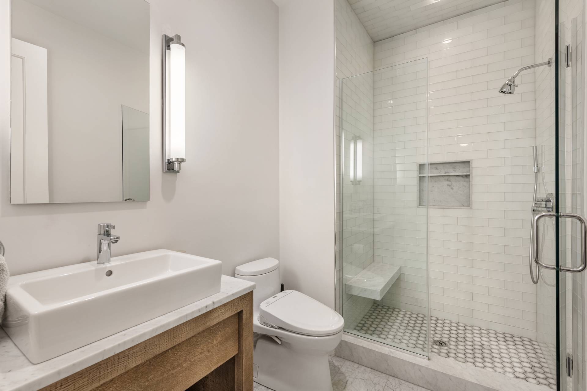 Undisclosed Address Sag Harbor, NY 11963 - Photo 15 of 36 a bathroom with a sink toilet and shower