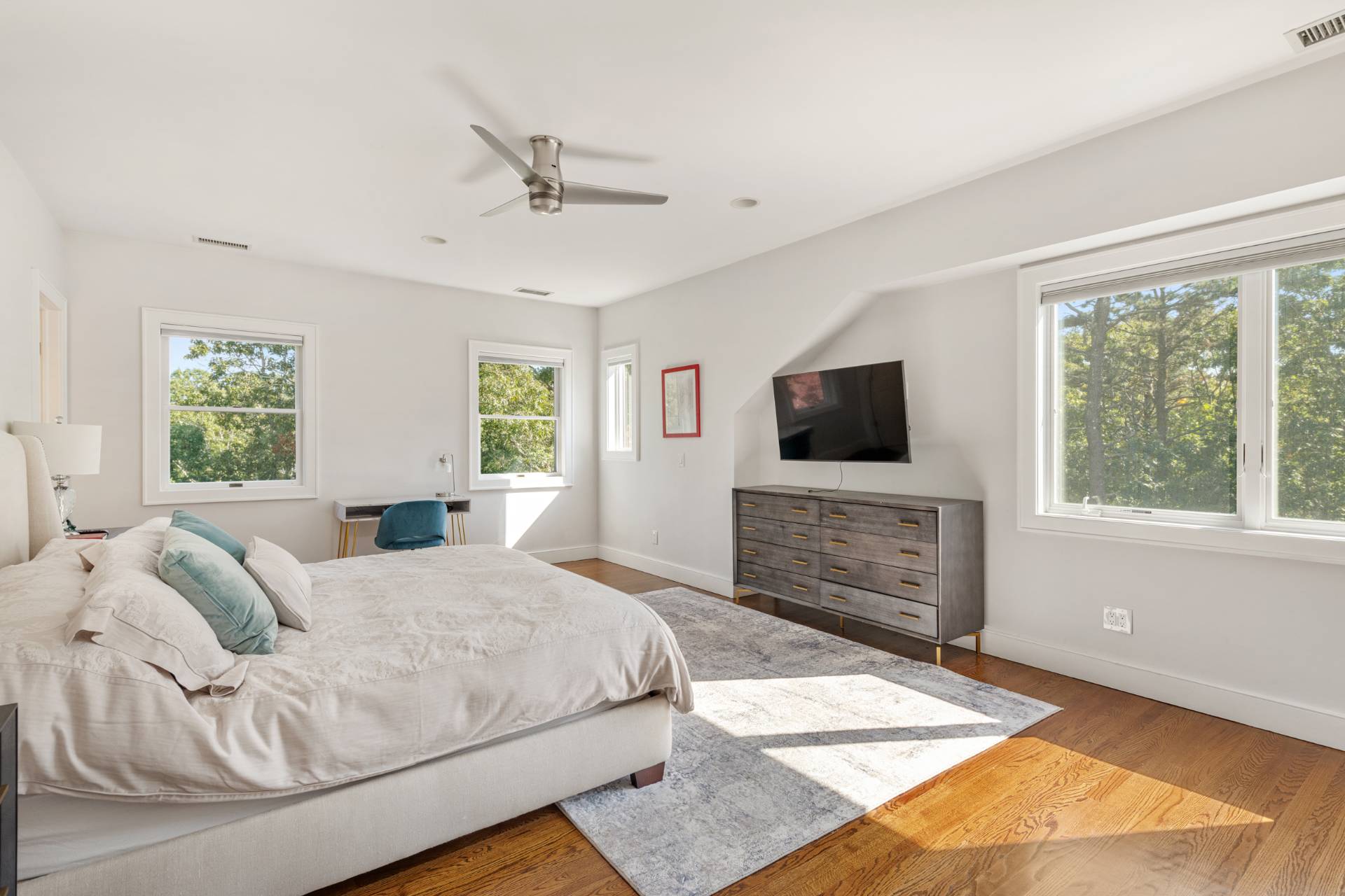 Undisclosed Address Sag Harbor, NY 11963 - Photo 16 of 36 a bedroom with a bed and a flat screen tv