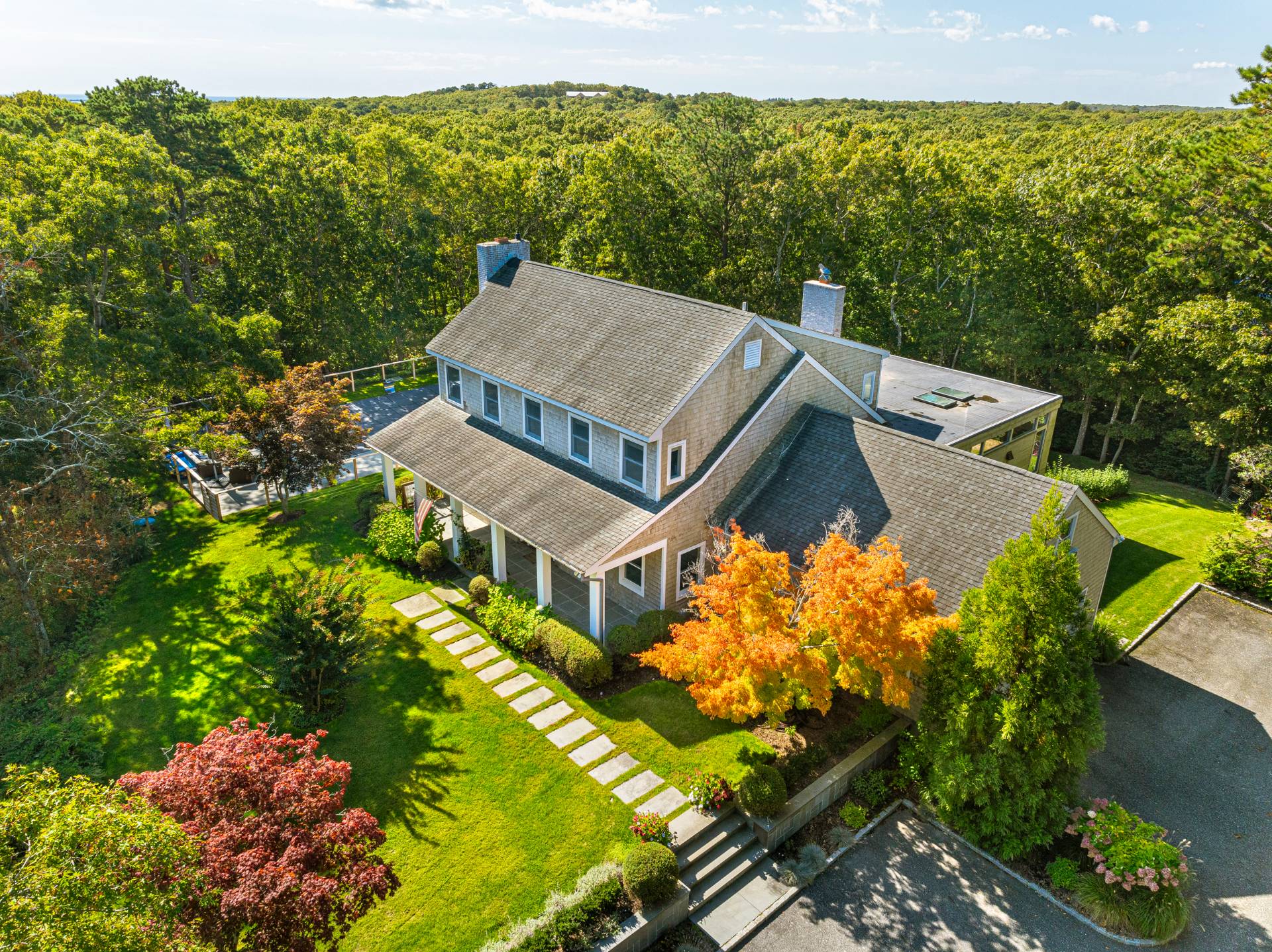 Undisclosed Address Sag Harbor, NY 11963 - Photo 2 of 36 front view of a house with a yard