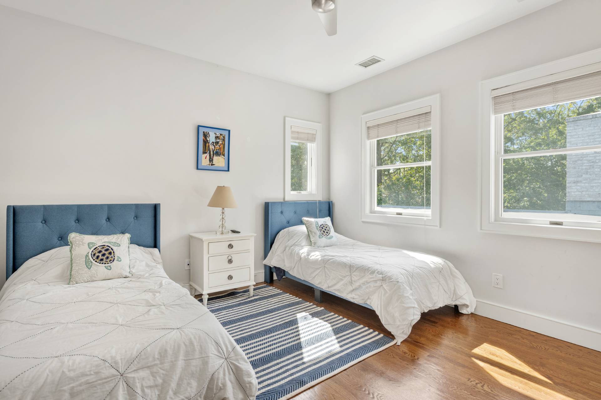 Undisclosed Address Sag Harbor, NY 11963 - Photo 21 of 36 a bedroom with two beds and a large window