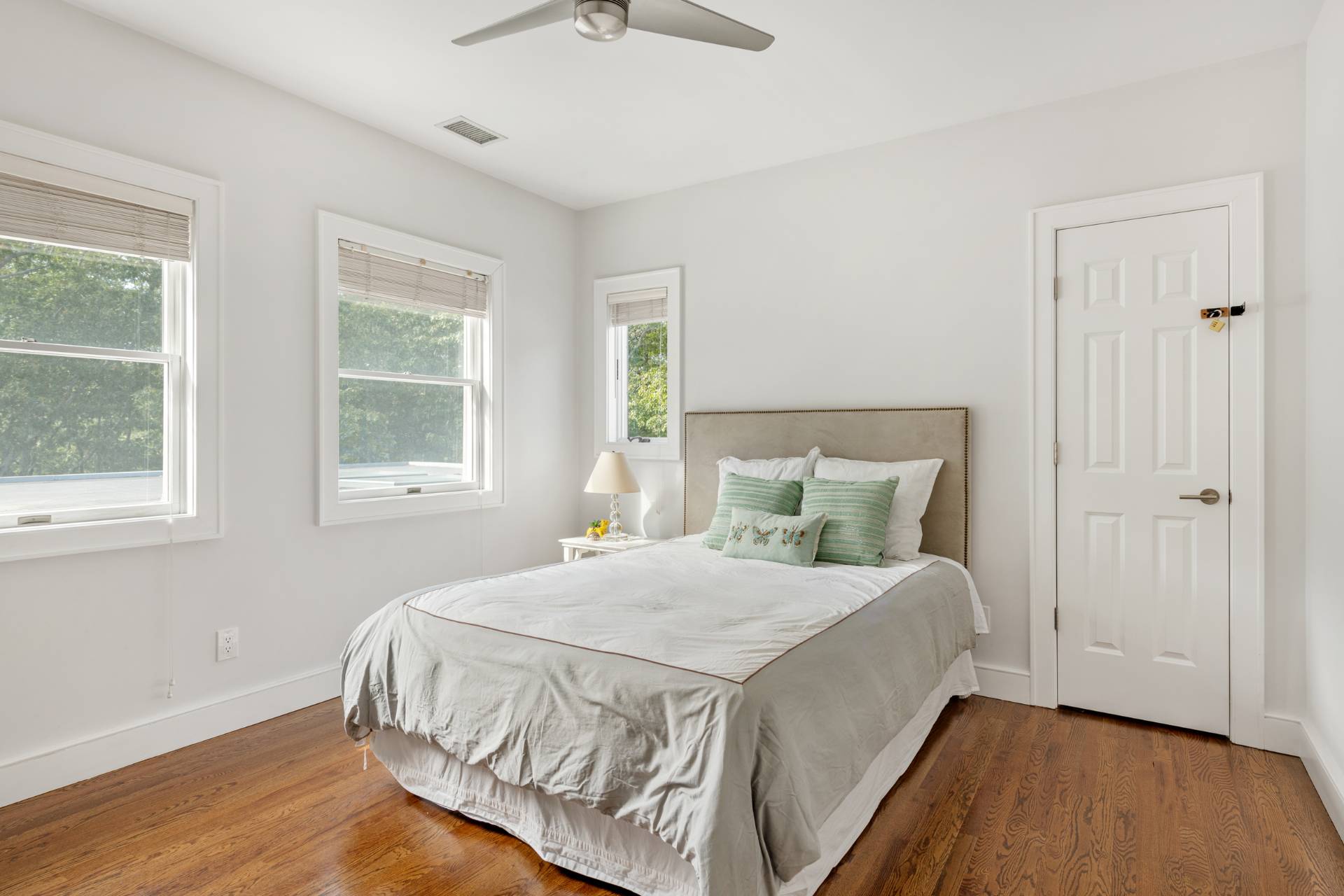 Undisclosed Address Sag Harbor, NY 11963 - Photo 23 of 36 a bedroom with a bed and wooden floor
