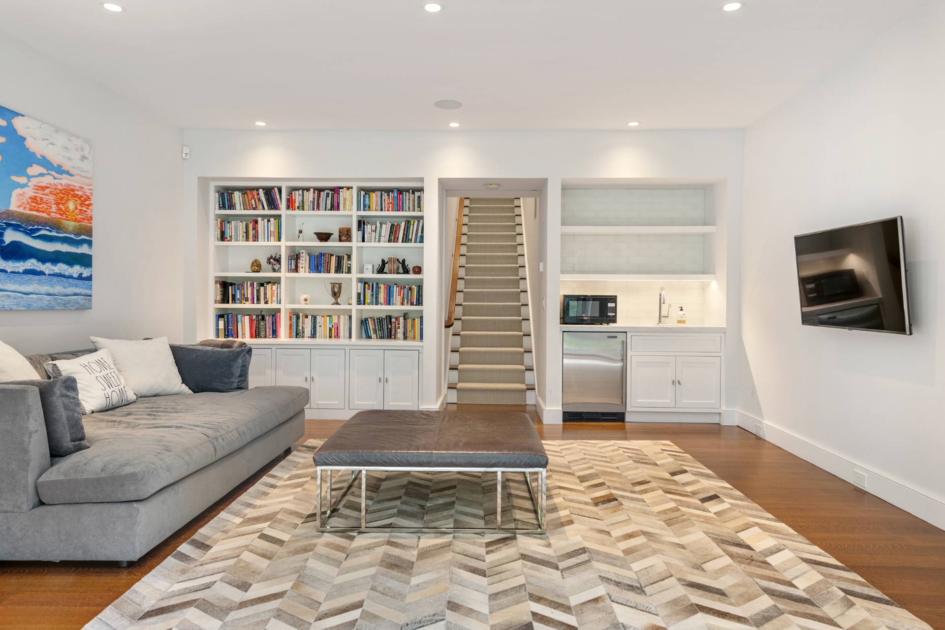 Undisclosed Address Sag Harbor, NY 11963 - Photo 26 of 36 a living room with furniture and a flat screen tv