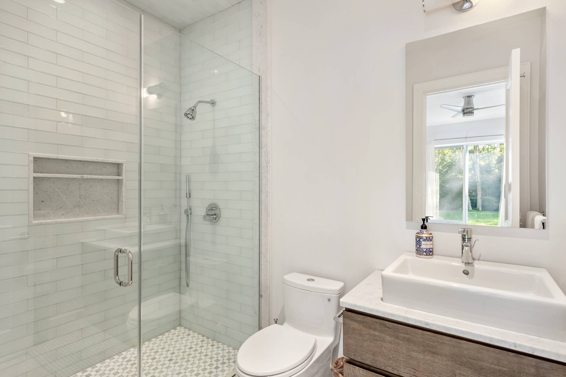 Undisclosed Address Sag Harbor, NY 11963 - Photo 28 of 36 a bathroom with a sink toilet and shower