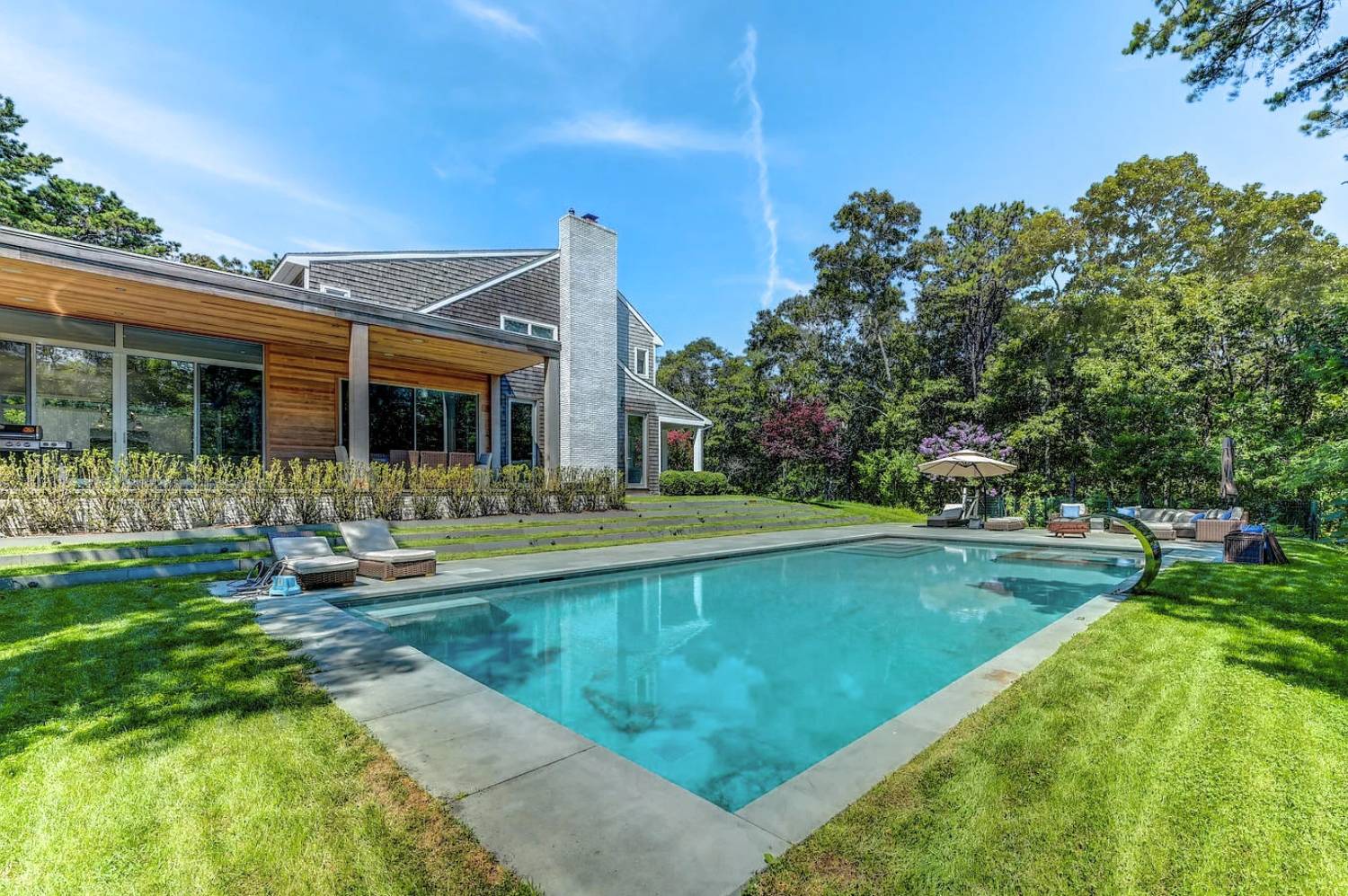 Undisclosed Address Sag Harbor, NY 11963 - Photo 3 of 36 a view of a house with swimming pool and a yard