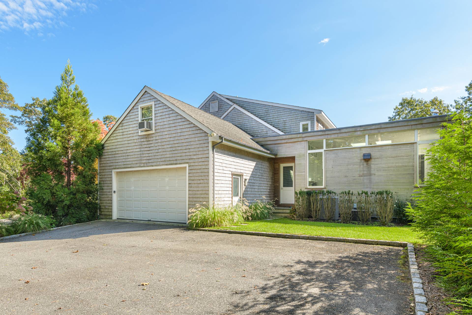 Undisclosed Address Sag Harbor, NY 11963 - Photo 34 of 36 a view of a house with a yard and garage